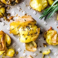 Top down view of baby gold potatoes on a pan with butter.