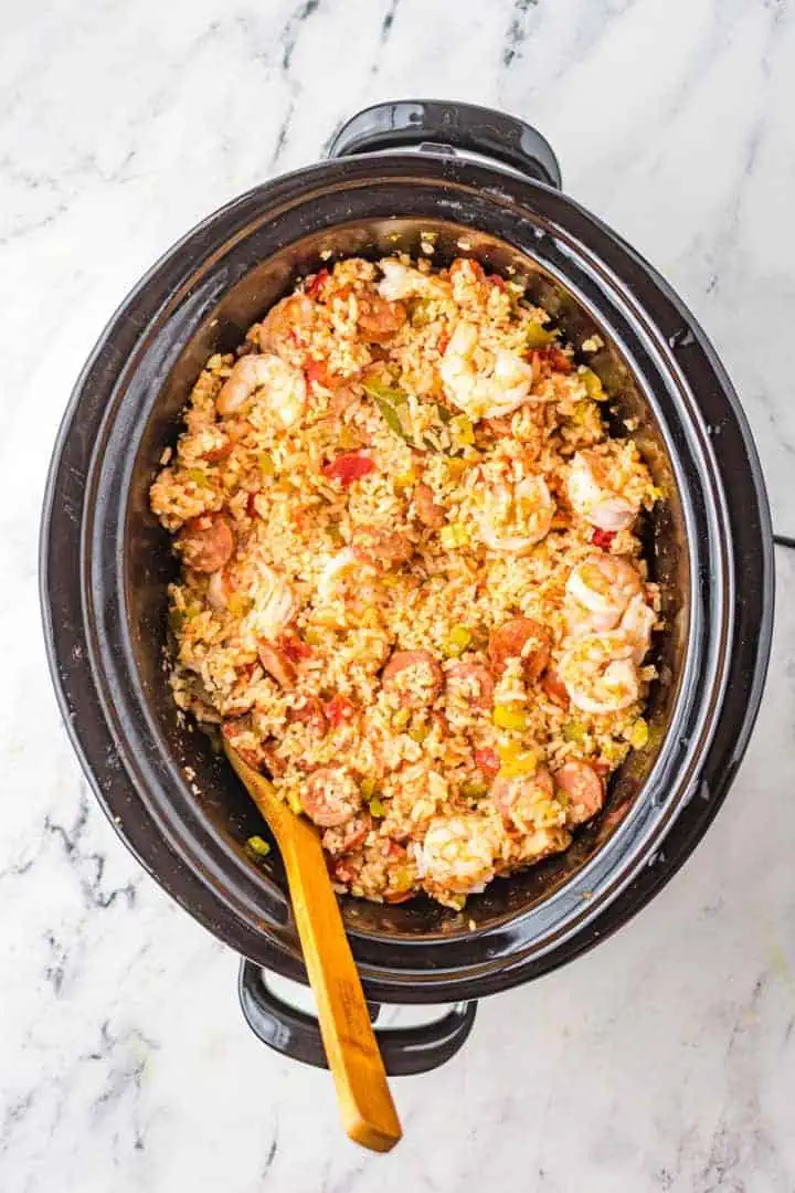 Top down view of a slow cooker of jambalaya.