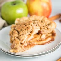 Dutch apple pie on a white plate.