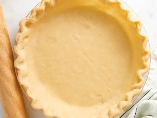 Top down view of butter pie crust in a dish.