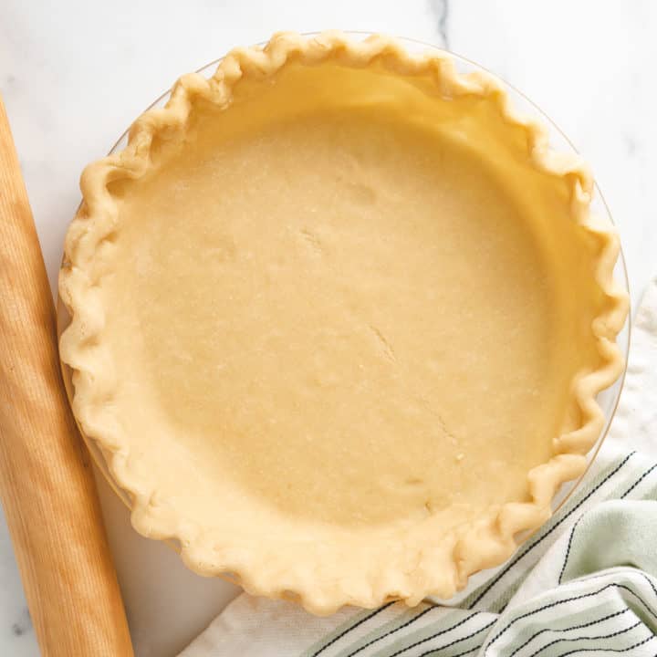 Top down view of butter pie crust in a dish.