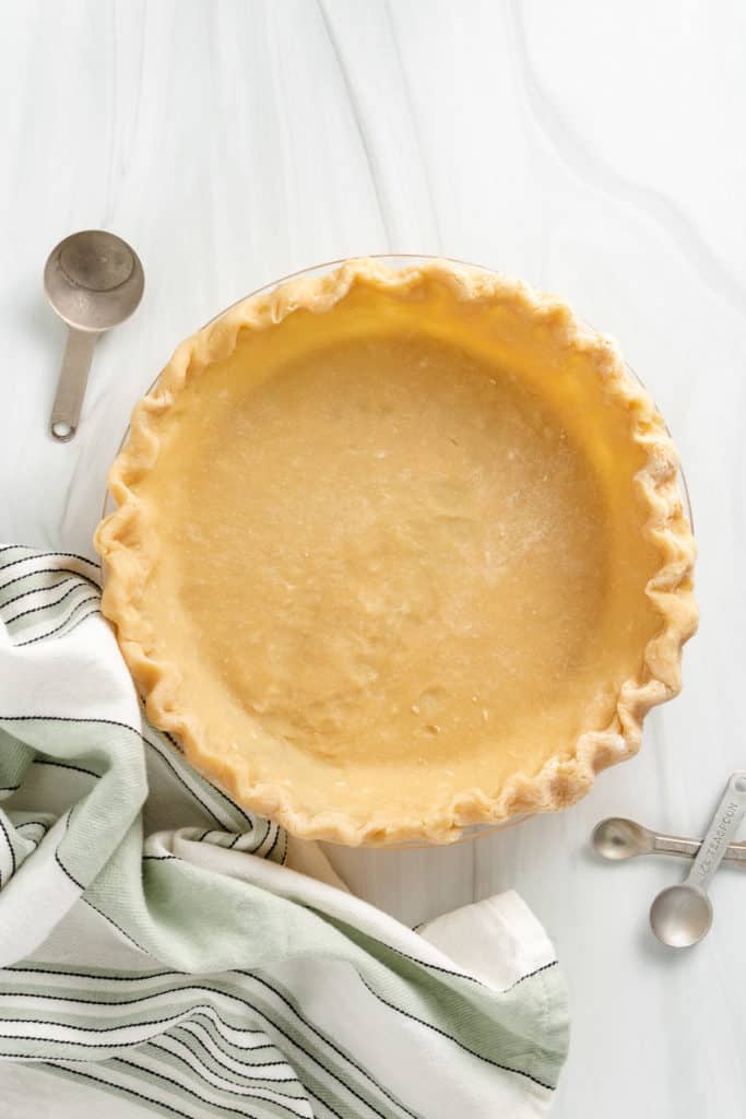 Top down view of pie shell in a dish.