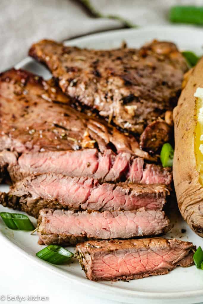 Close up of sliced Sirloin Steak on a plate.