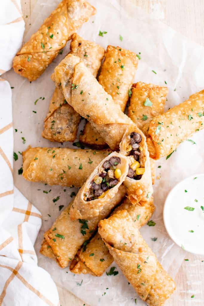 Top down view of egg rolls sprinkled with parsley
