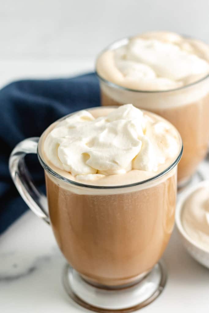 Two amaretto coffees with whipped cream.