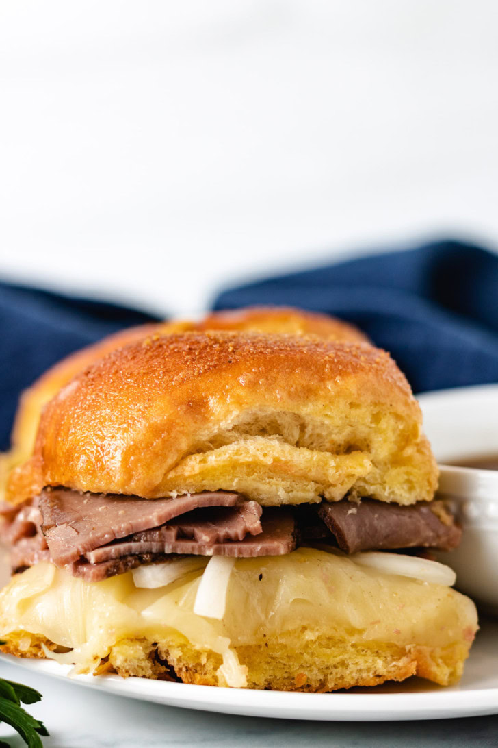 Close up of a French Dip Slider and au jus sauce.