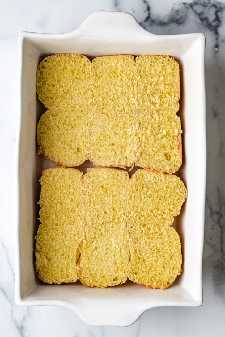 Top down view of buns in a pan.