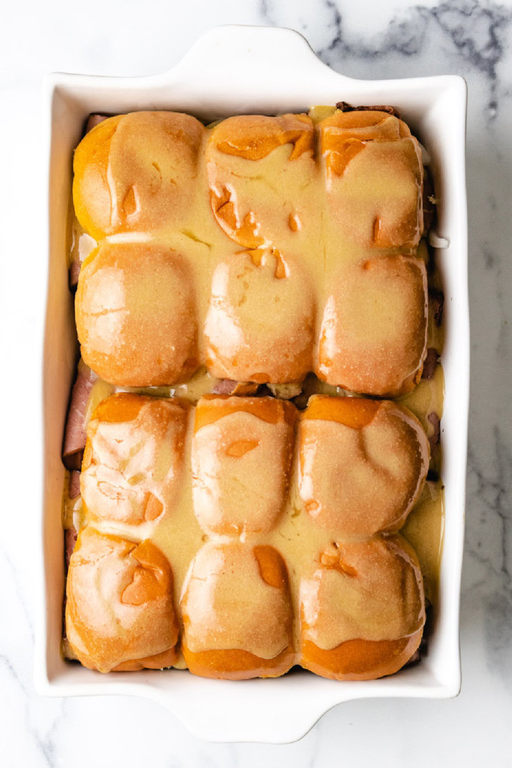 Top down view of sliders with mustard sauce.