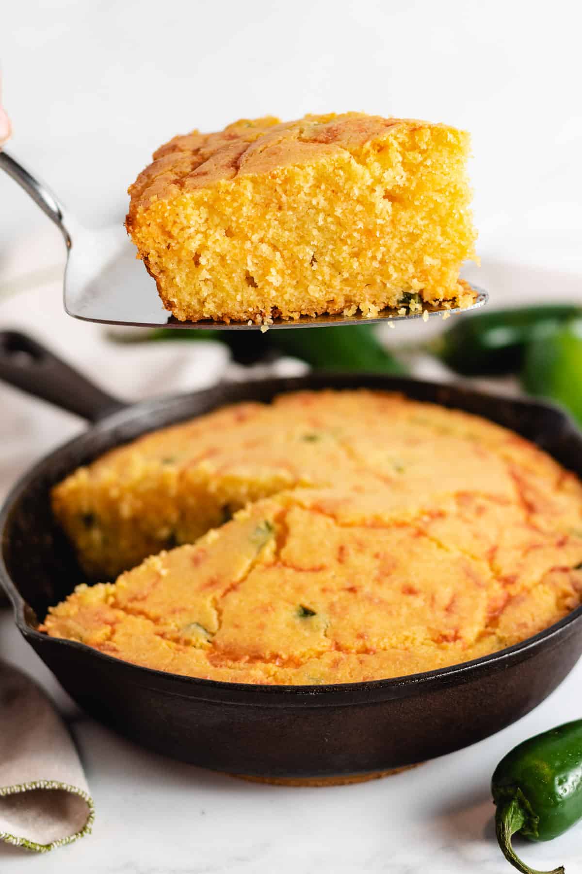 Cast iron skillet filled with spicy cornbread.