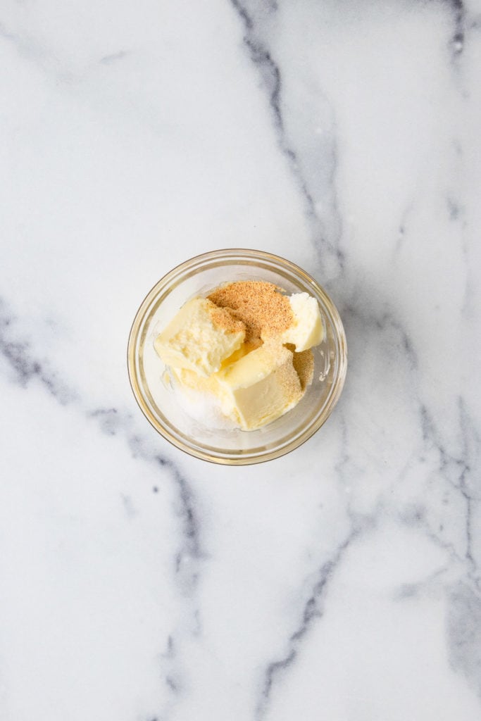 Top down view of butter and garlic seasoning in a ramekin.