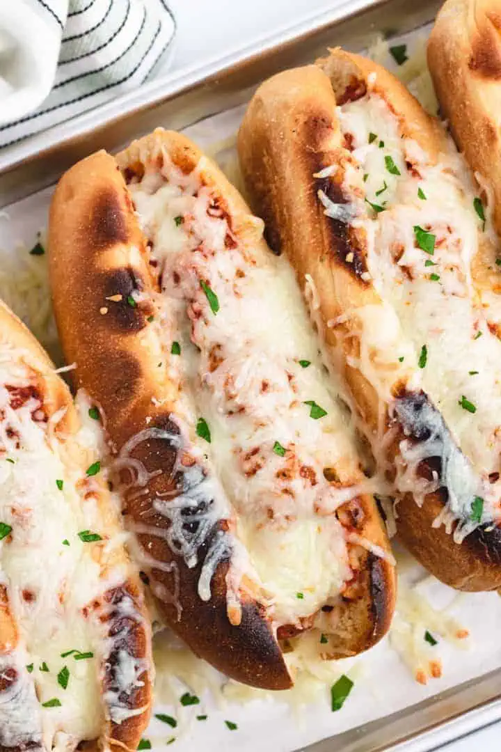 Top down view of meatballs subs on a platter.