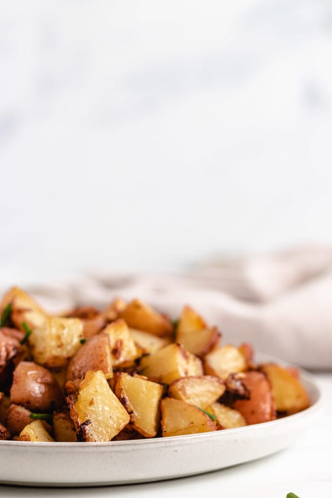 Plate of onion soup potatoes on a serving dish.