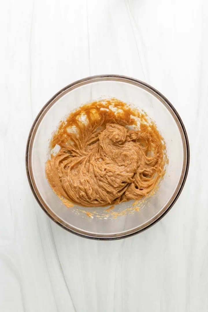 Peanut butter and powdered sugar in a bowl.