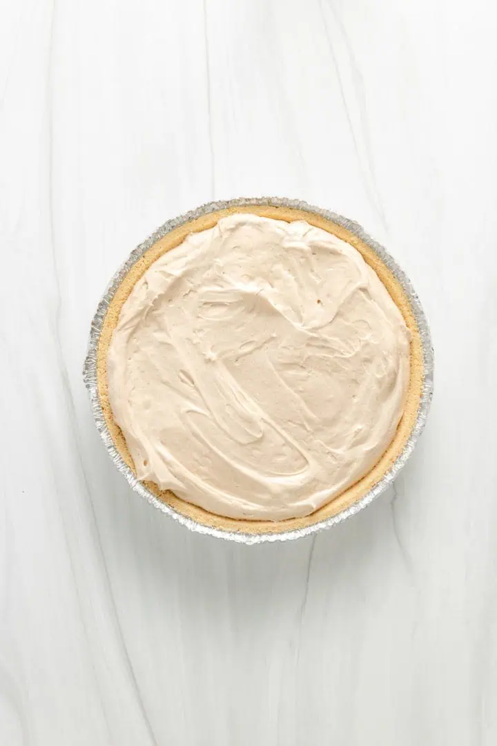 Top down view of peanut butter pie in a pie shell.