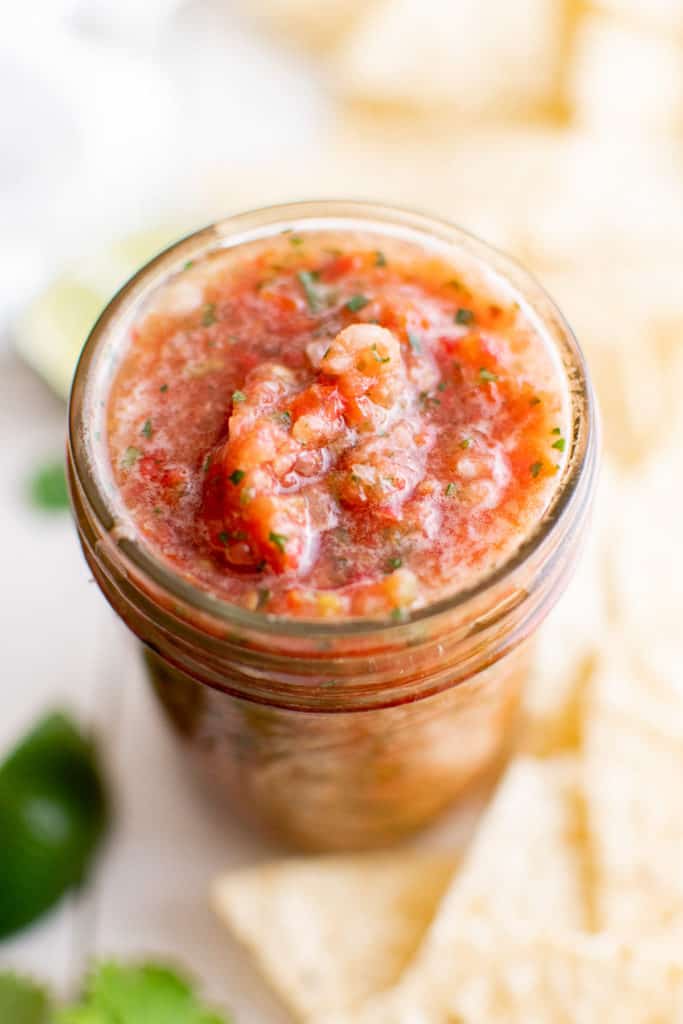 Fresh salsa in a mason jar.