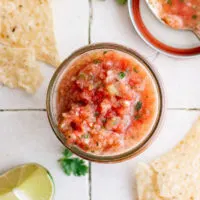 Top down view of salsa in a jar.