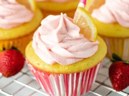 Strawberry lemonade cupcakes on a wire rack.