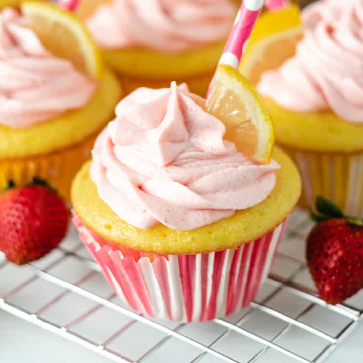 Strawberry lemonade cupcakes on a wire rack.