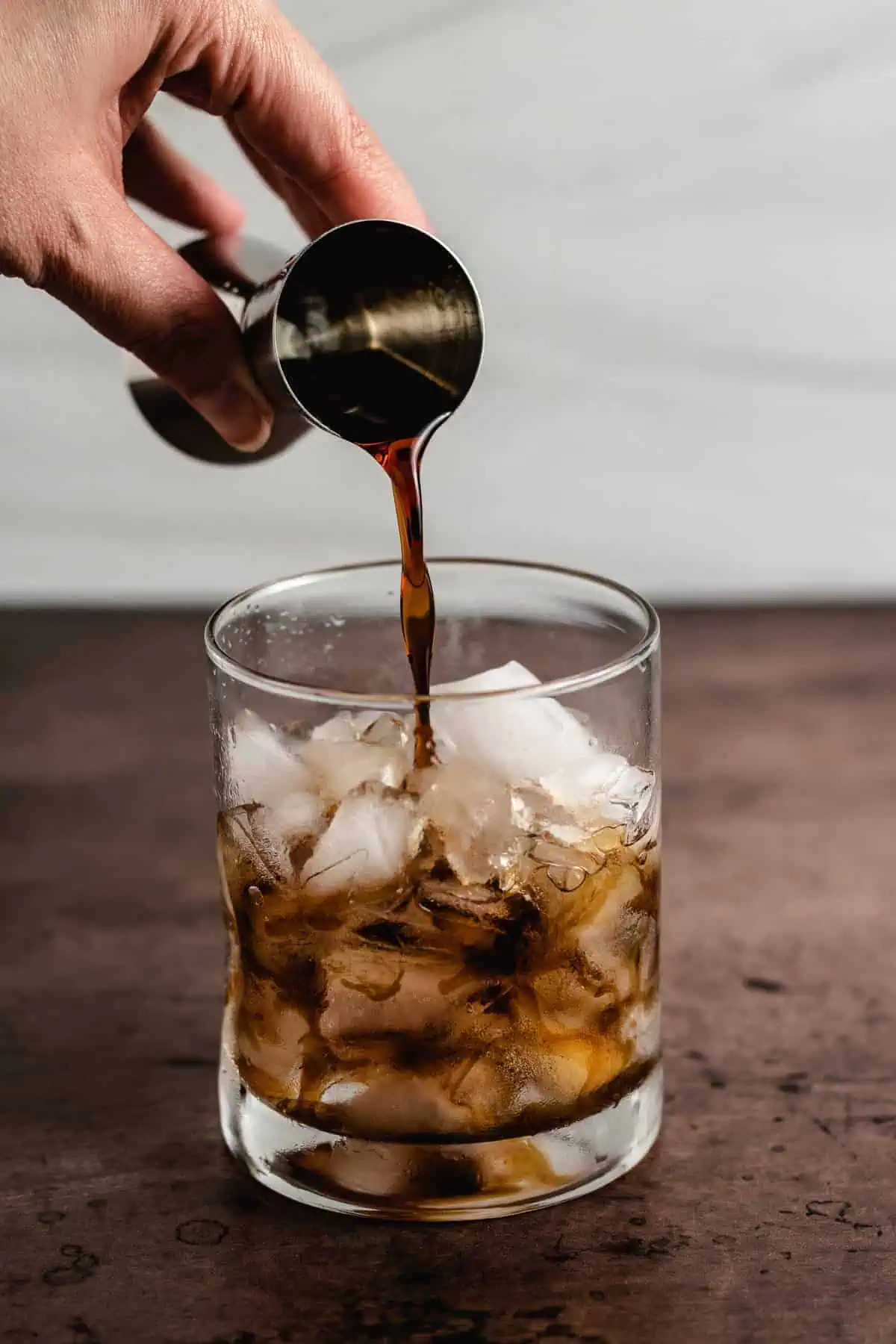 Kahlua being poured over ice.
