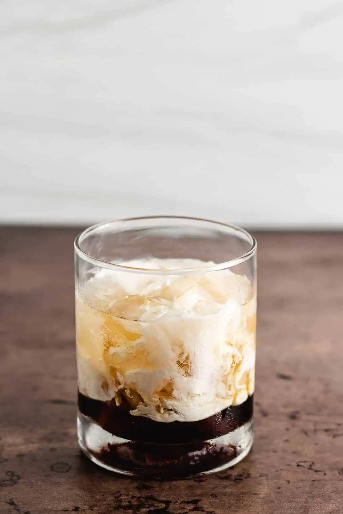 White Russian in a cocktail glass.