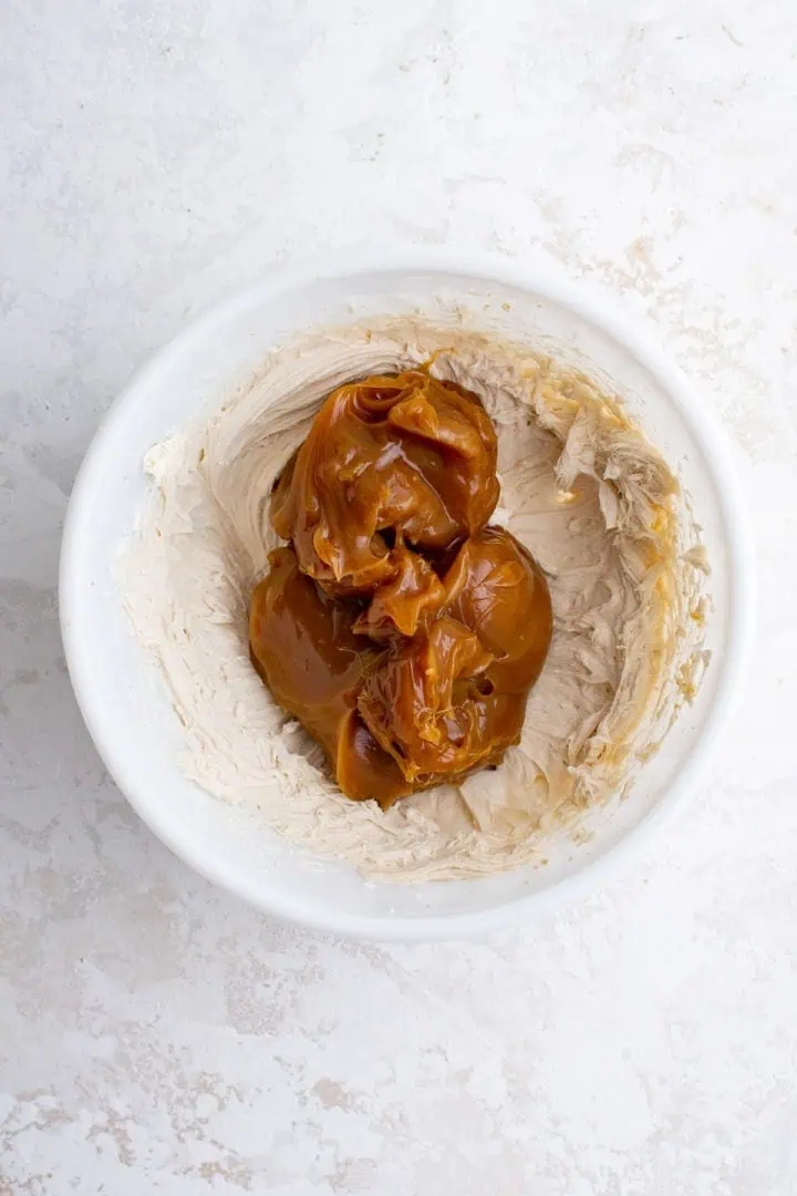 Top down view of caramel on top of cream cheese.