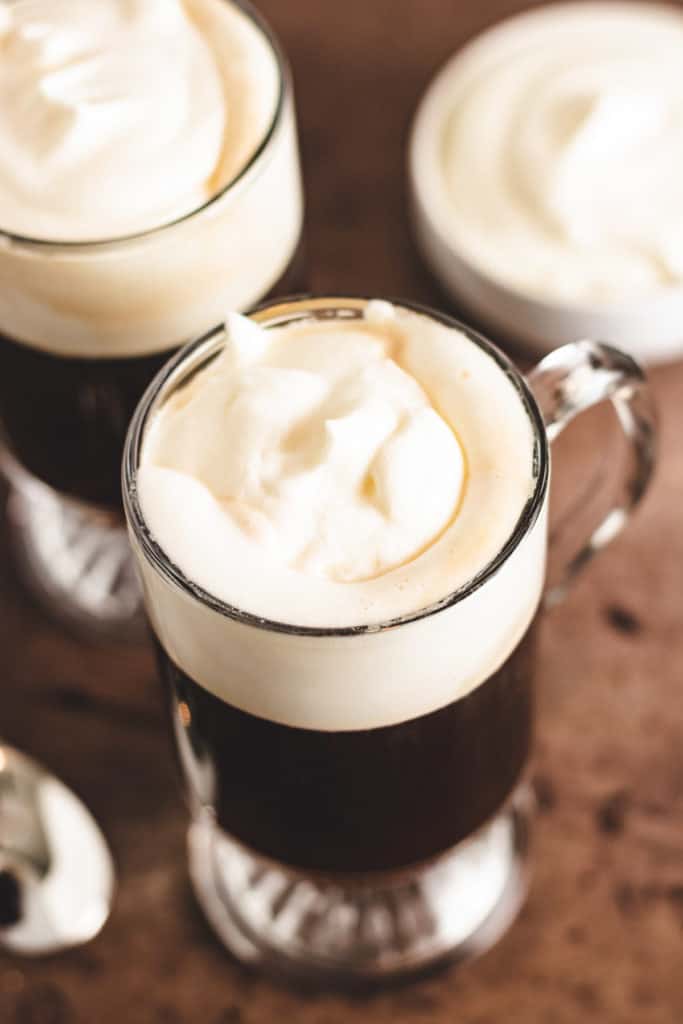 Top down view of a coffee cocktail with whipped cream.