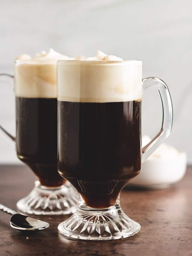 Two mugs of irish coffee.