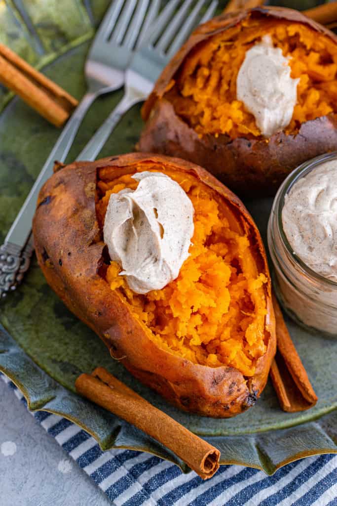 Fluffy baked potato topped with whipped butter.