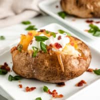 Crock pot baked potato with toppings.