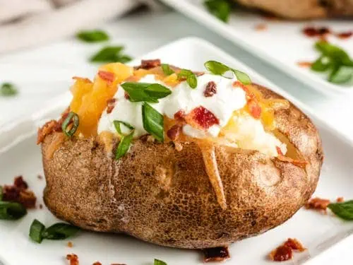 Crock pot baked potato with toppings.