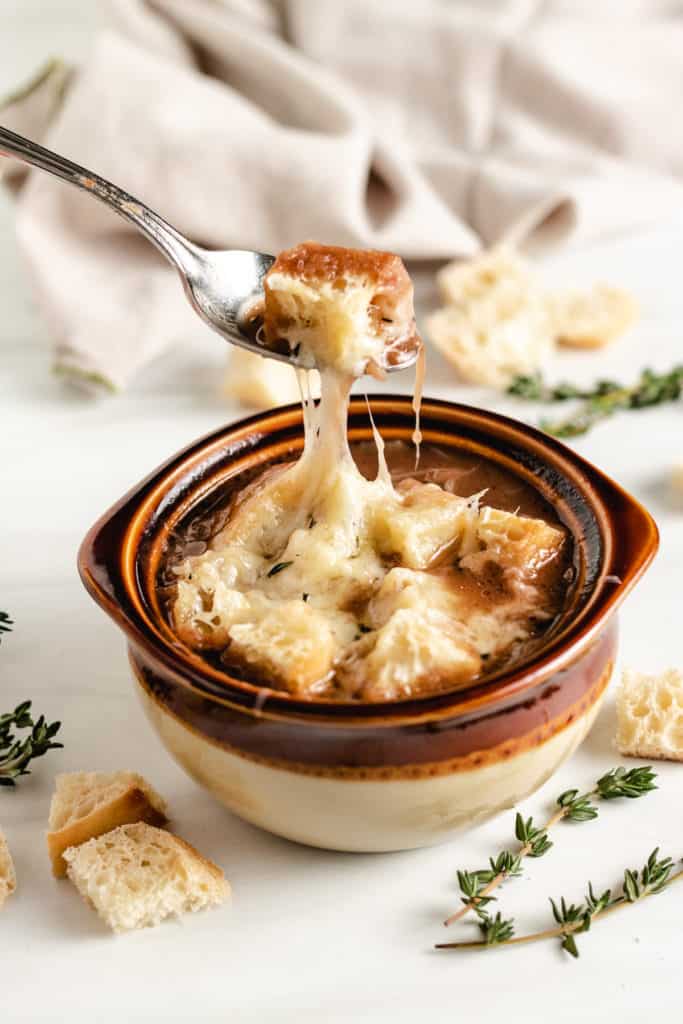 Soup bowl with croutons and melted gruyere.