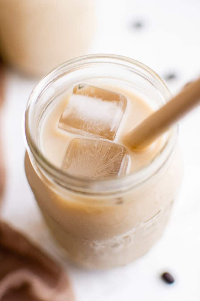 Top down view of iced shaken espresso in a jar.