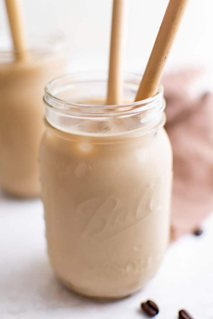Jar of brown sugar oat milk espresso with two straws.