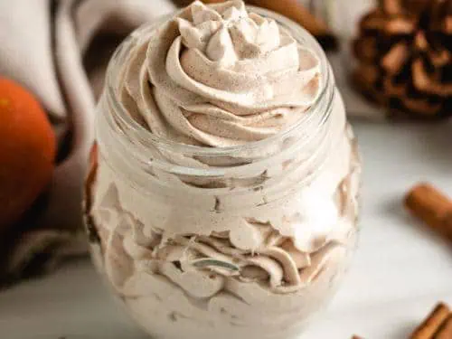 Top down view of spiced whipped cream in a jar.