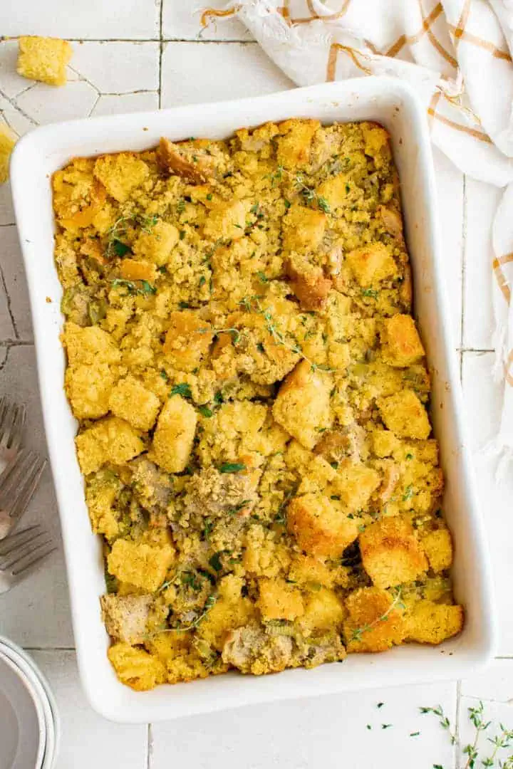 Southern Cornbread Dressing Recipe Top down view of cornbread stuffing in a casserole dish.