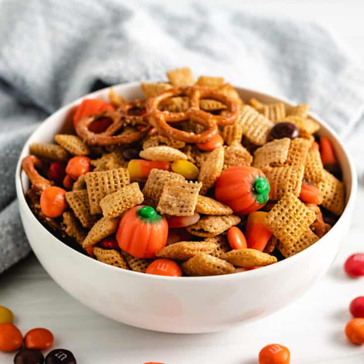 Serving dish filled with snack mix and candy.