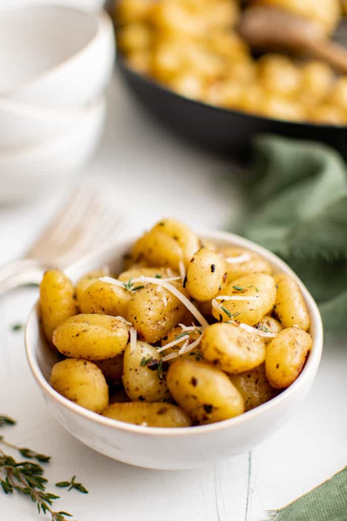 Bowl filled with fried gnocchi.