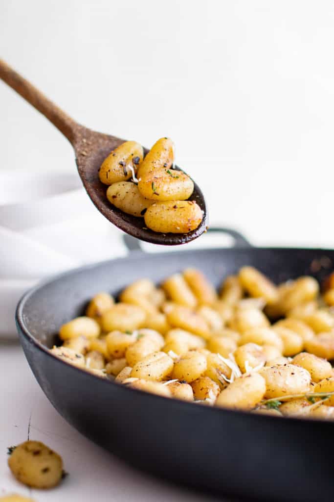 Skillet of fried gnocchi.