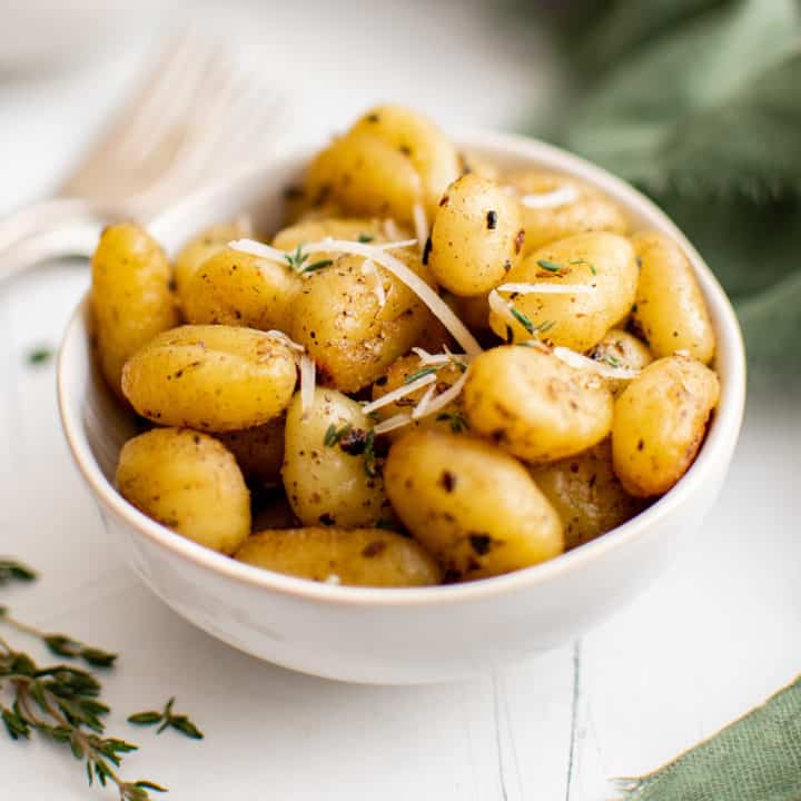 Pan Fried Gnocchi White bowl filled with pan fried gnocchi.