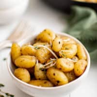 Small bowl filled with pan fried gnocchi.