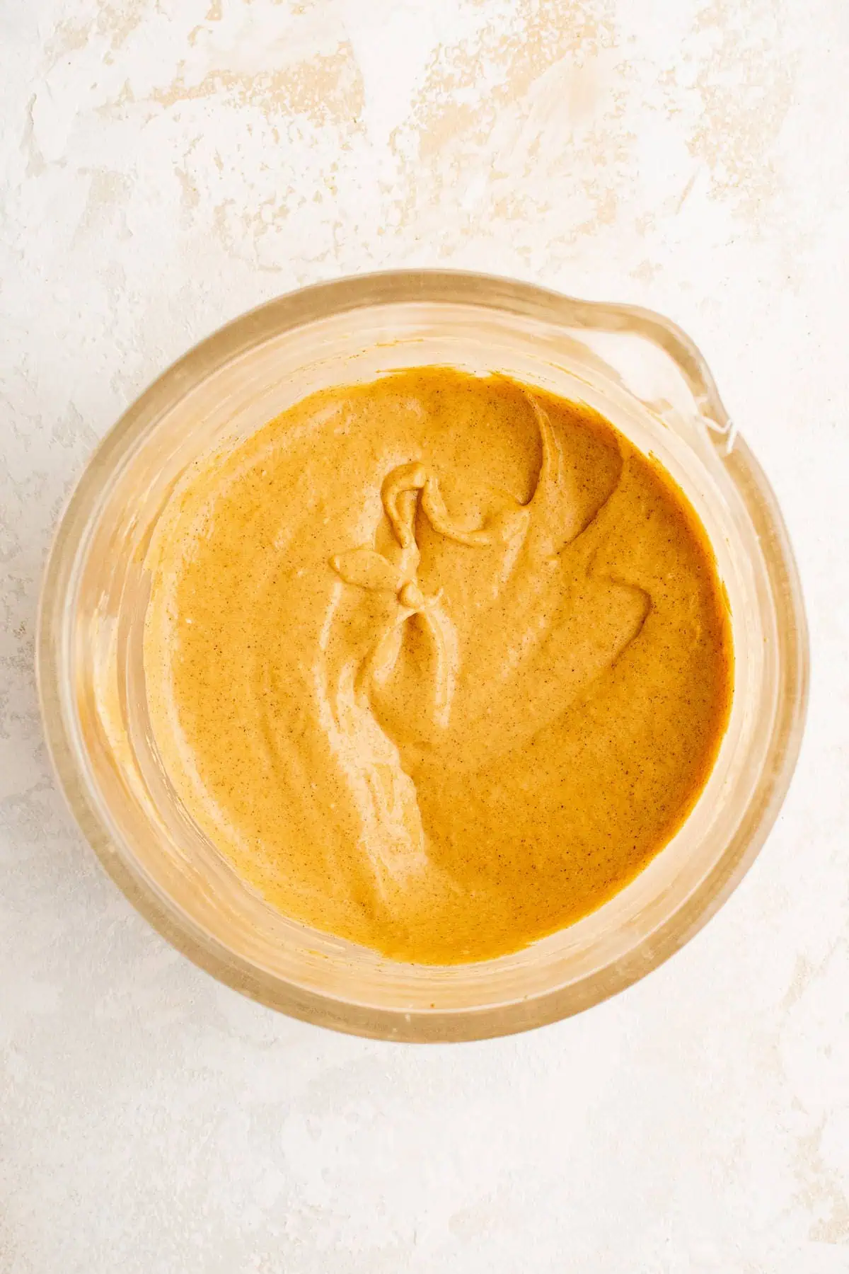 Top down view of pumpkin cream cheese in a bowl.