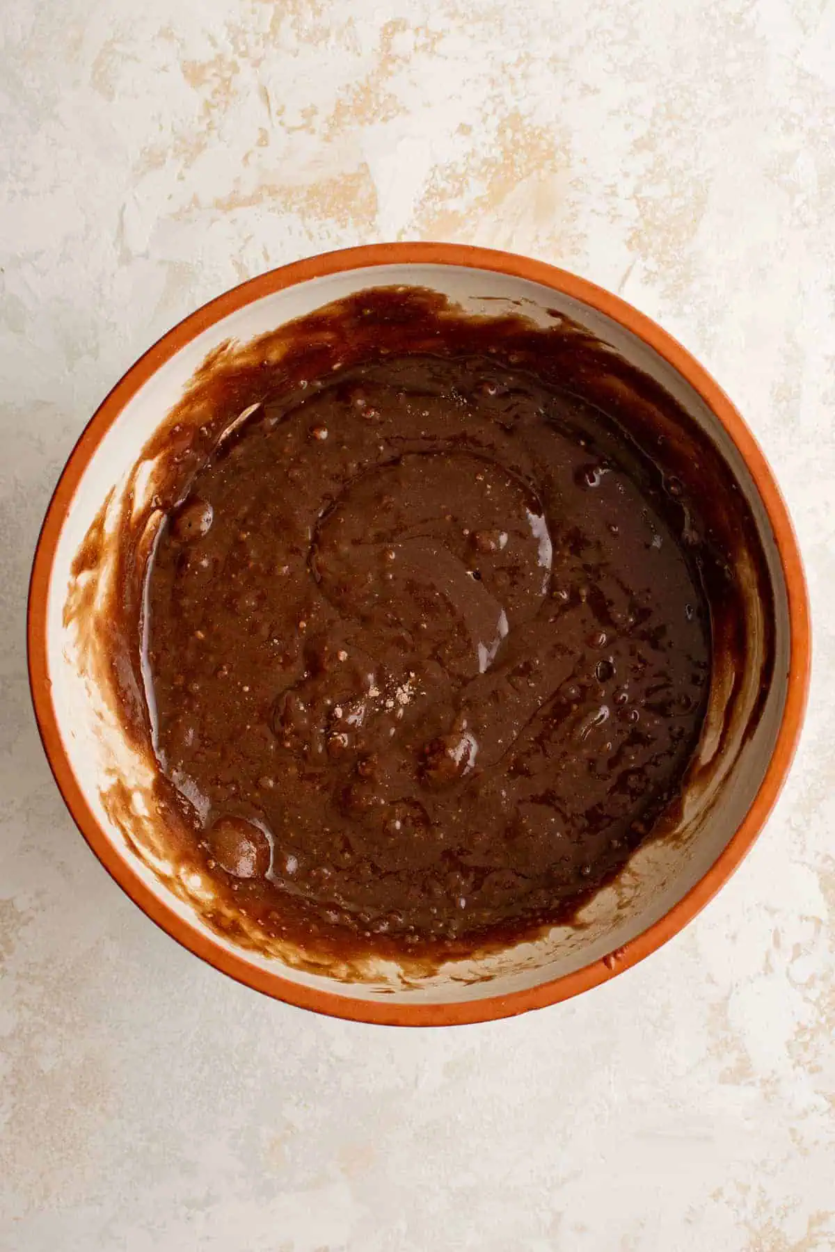 Top down view of brownie batter in a bowl.