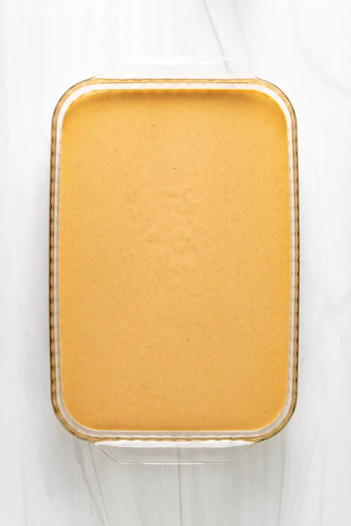 Top down view of unbaked cheesecake bars.