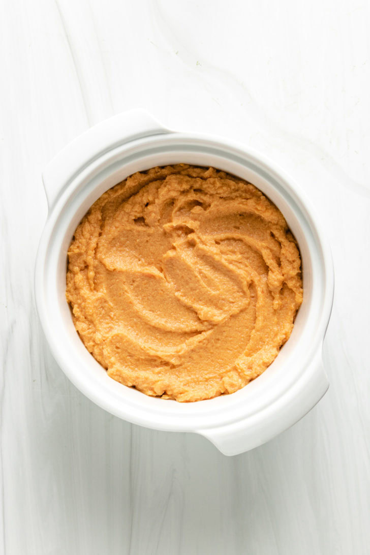 Sweet potato casserole filling in a casserole dish.