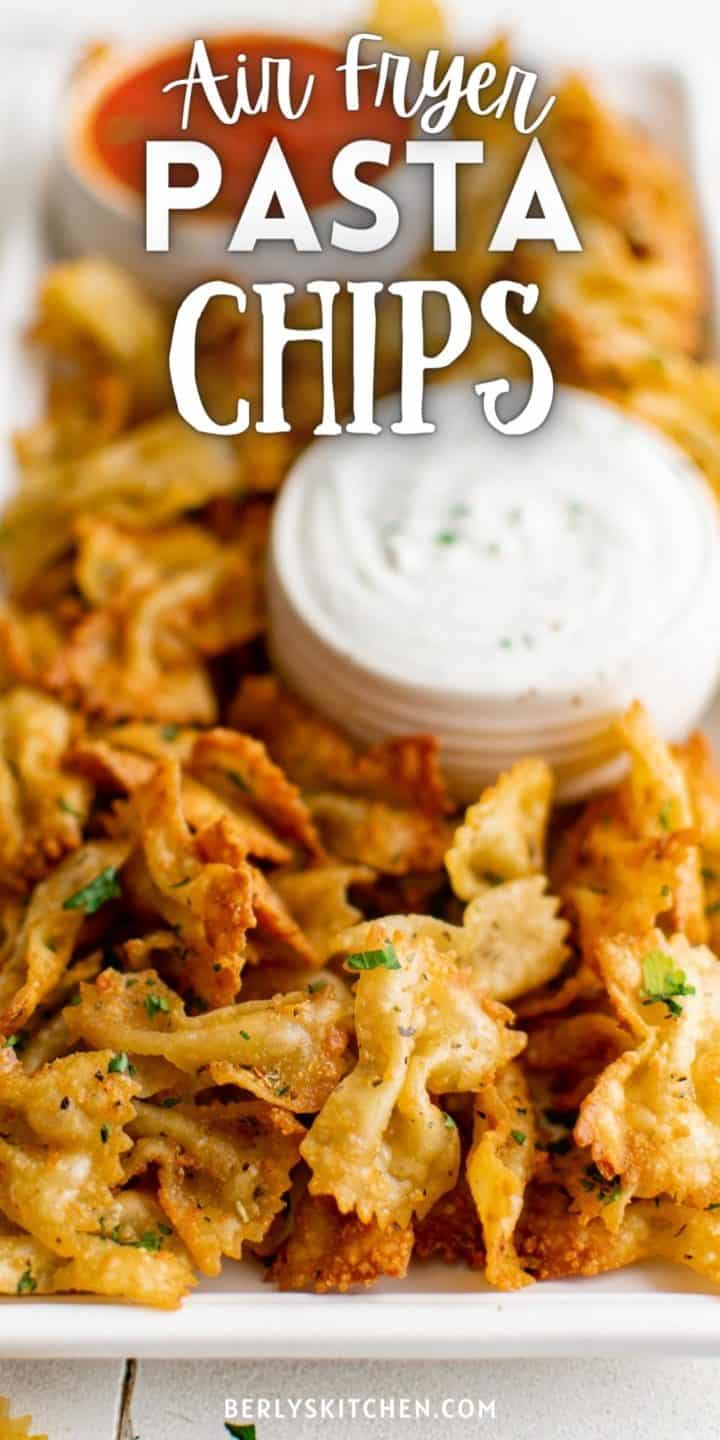 Close up view of a platter of air fryer pasta chips.