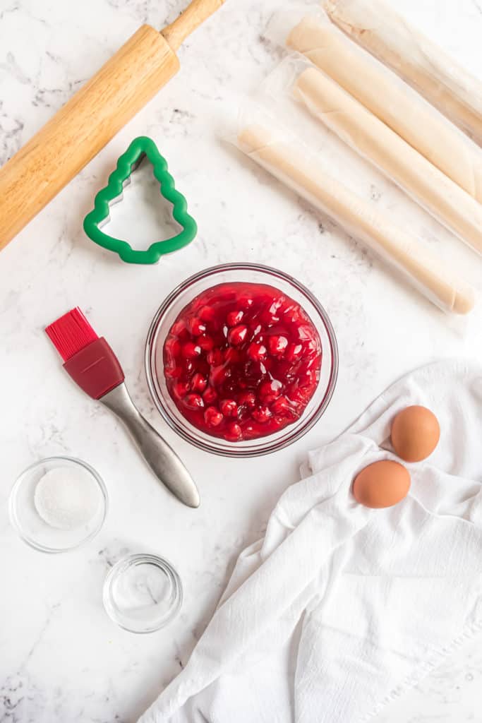 Top down view of ingredients needed for cherry hand pies.