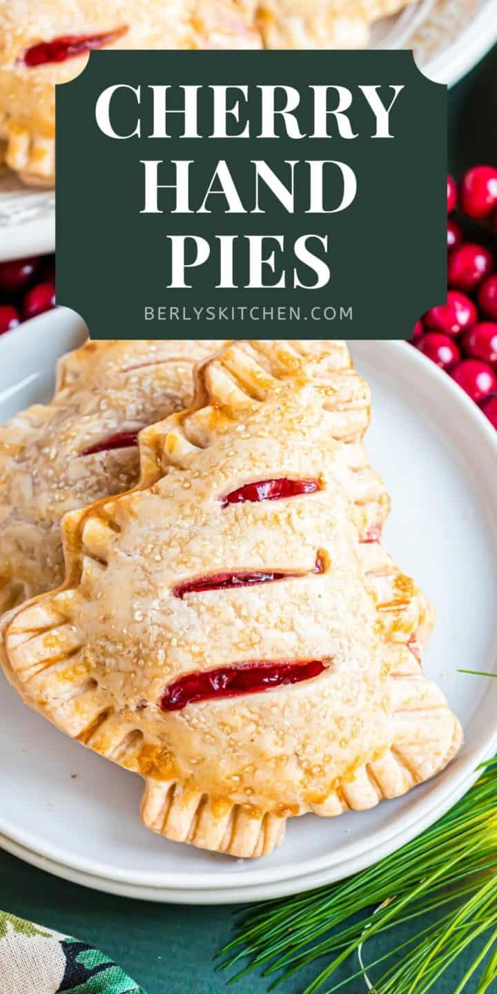 Close up of Christmas tree cherry hand pies on a plate.