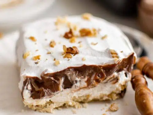 Slice of chocolate lasagna with a spoon.