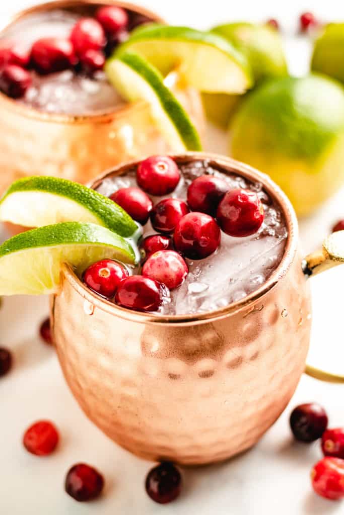 Cranberry moscow mule in a copper mug.
