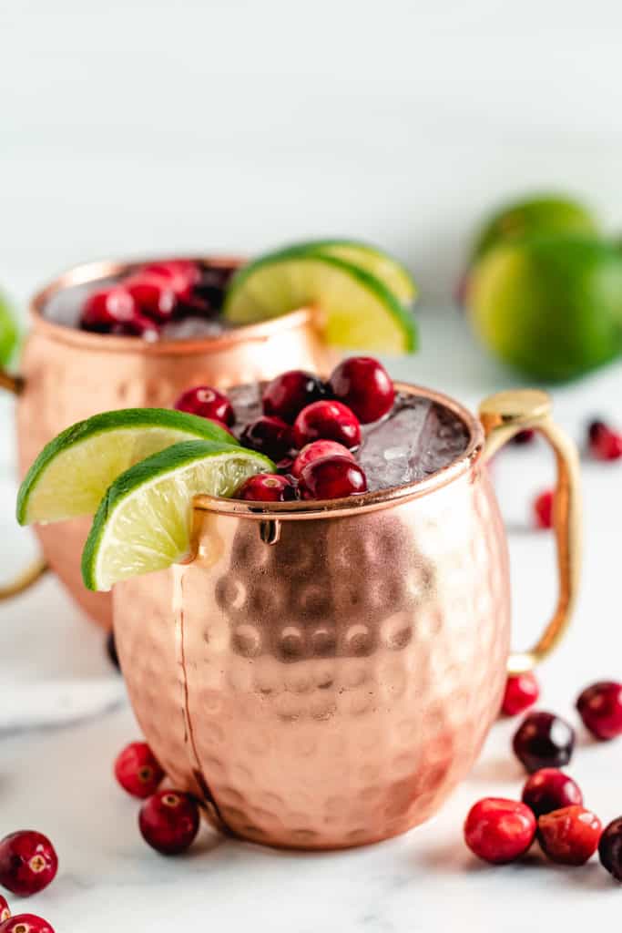 Cranberry moscow mule in a copper mugs.